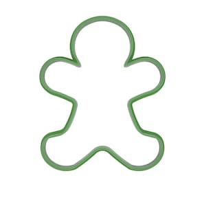 May include: A green gingerbread man cookie cutter. The cutter is made of a solid green material and has a simple outline of a gingerbread man shape. The cutter is designed for baking and crafting.