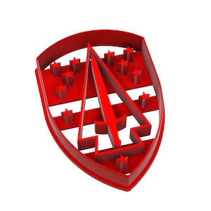 May include: A red cookie cutter in the shape of a shield with a sword and stars. The shield has a curved top and a pointed bottom. The sword is in the center, and there are stars on either side.