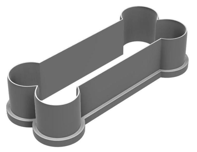 May include: A gray plastic dog bone-shaped cookie cutter. The cutter has a rectangular center with rounded ends, and a thin white outline. The design is simple and clean, perfect for making dog treats or themed cookies.