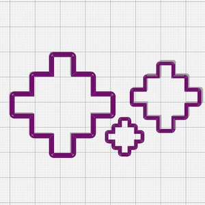 May include: Three purple cross-shaped cookie cutters of varying sizes. The cutters have a 3D effect with a darker purple shadow, set against a white grid background. These are ideal for creating decorative cookies or other baked goods.