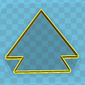 May include: A yellow and brown arrow-shaped cookie cutter. The cutter has a triangular top with a horizontal base and two rectangular extensions. The background is a light blue checkered pattern.