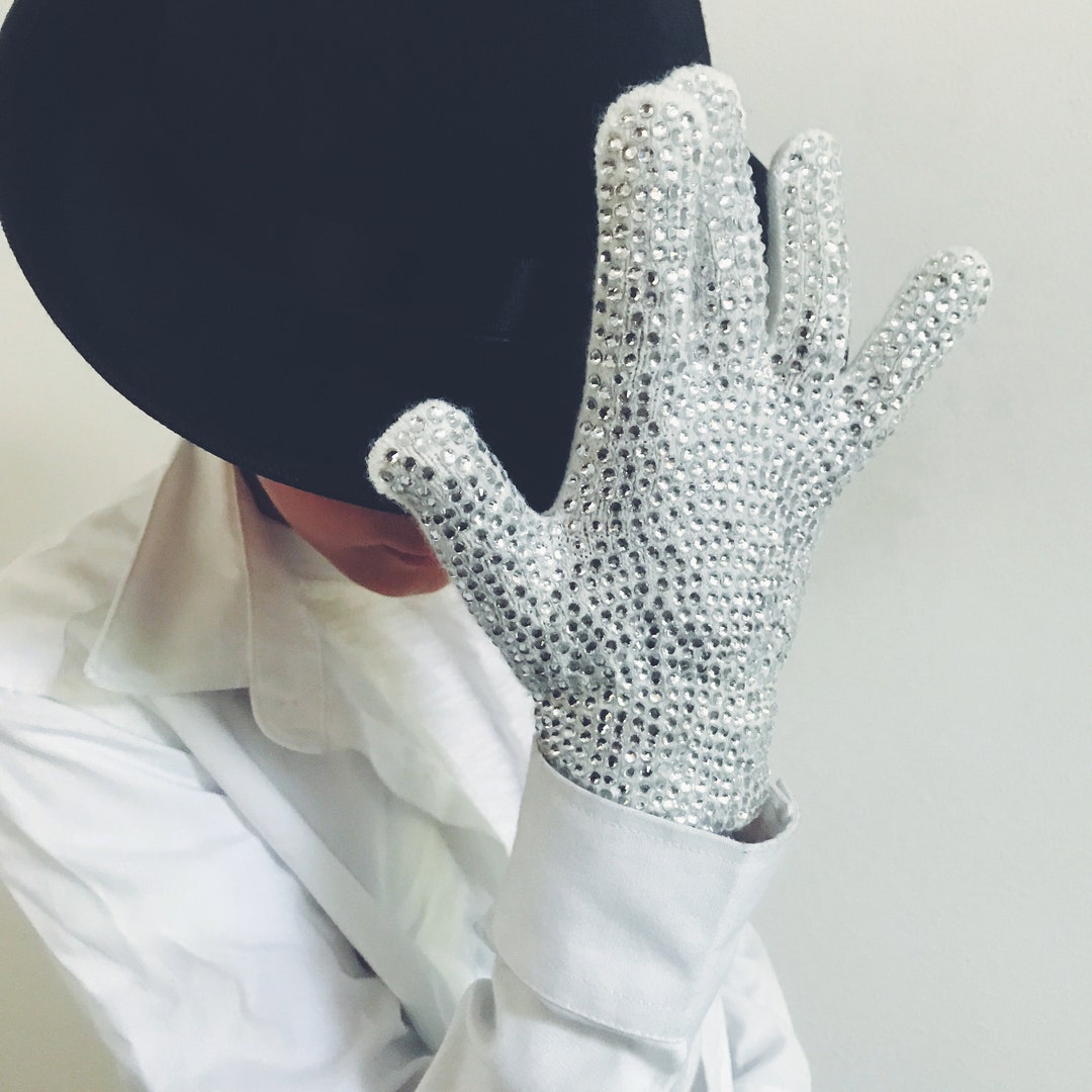 Michael Jackson's iconic white glove sells for over 85,000 pounds