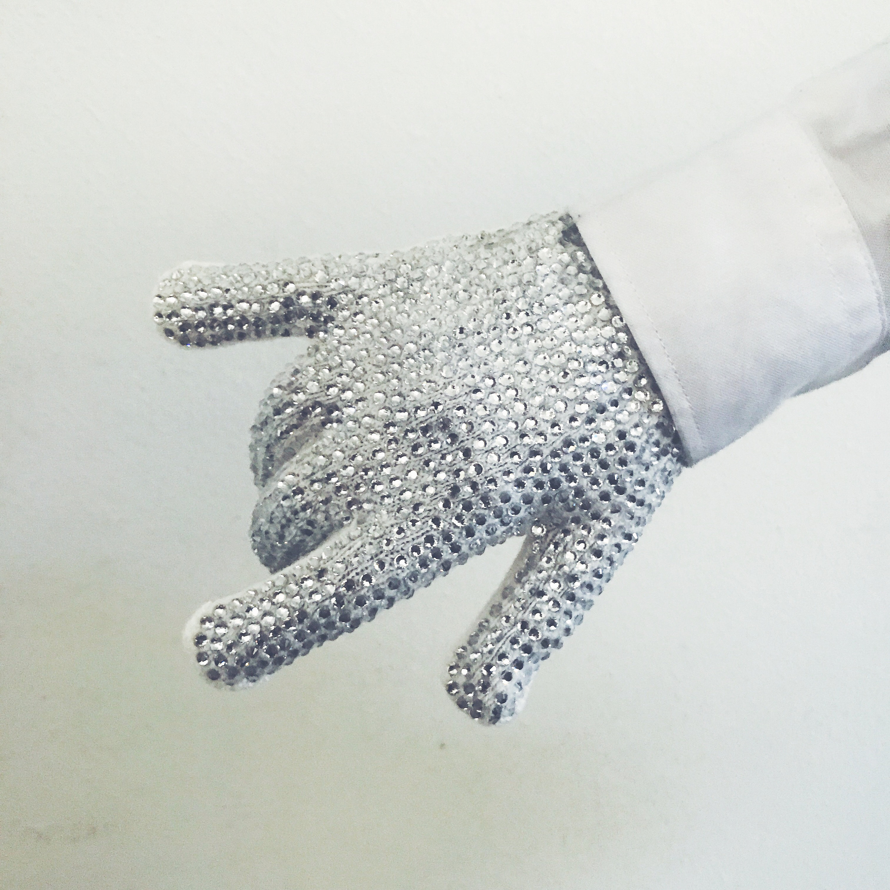 Michael Jackson's famous white diamante glove sells for £254,000