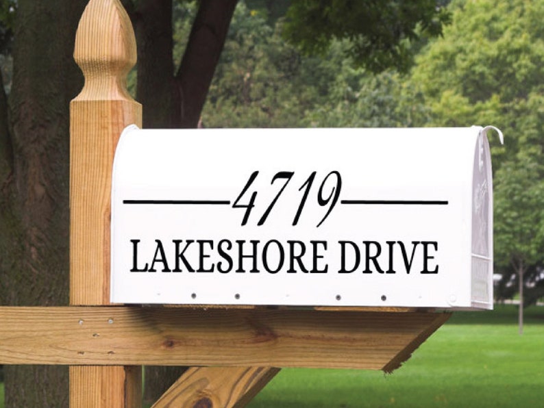 May include: White mailbox with black lettering. The address is 4719 Lakeshore Drive.