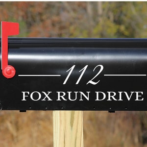 May include: Black mailbox with a white number "112" and the text "FOX RUN DRIVE" in white lettering.