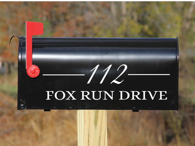 May include: Black mailbox with a white number "112" and the text "FOX RUN DRIVE" in white lettering.