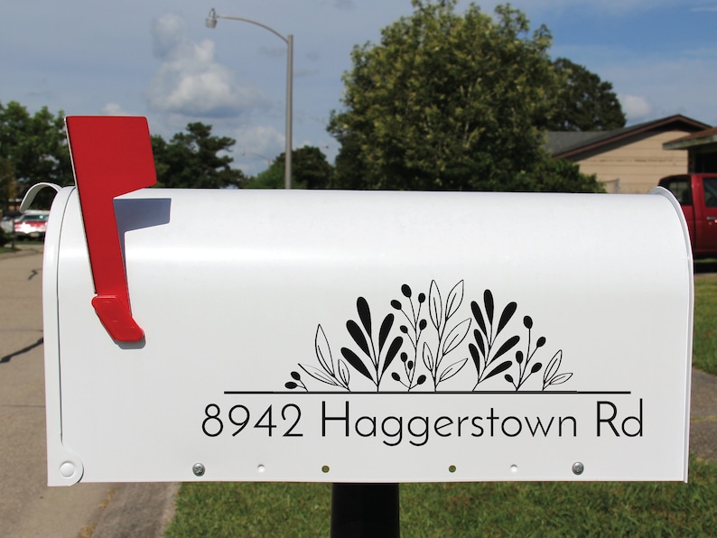 Rustic mailbox with custom floral design decal, demonstrating how to enhance curb appeal