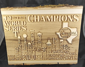May include: A wooden sign with the words "2023 World Series Champions" and the Texas Rangers logo. The sign also includes the names of the players on the team.