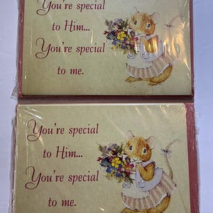 May include: Two sets of greeting cards, each wrapped in clear plastic. The cards feature a cartoon mouse holding a bouquet of flowers. Text on the cards reads "You're special to Him... You're special to me."