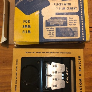May include: A vintage Kalart Custom 8-Splicer film editor for 8mm film. The splicer is made of black plastic and metal. The box is yellow and blue with the text "Kalart Custom 8-Splicer" and "Splices with Film Cement".