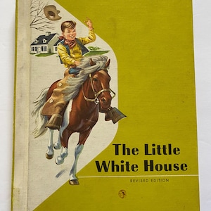 May include: Vintage book cover for "The Little White House" from The Ginn Basic Readers series. The cover features a boy riding a brown horse, with a white house and a cowboy hat in the background. The cover is yellow and white.