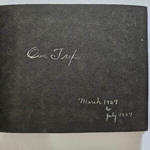 May include: Black photo album with the title "Our Trip" written in white cursive. The dates "March 1927 to July 1927" are written below the title.