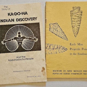 May include: Two vintage paperback books about Native American history. The book on the left is titled "The Story of Ka-Do-Ha Indian Discovery" and features a drawing of a person with outstretched arms. The book on the right is titled "Early Man Projectile Points in the Southwest" and features drawings of arrowheads. Both books are published by the Museum of New Mexico Press.
