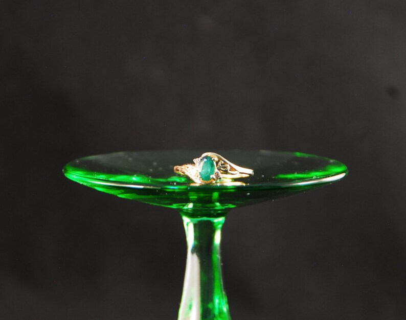 Emerald ring in 10K gold with small diamond accents