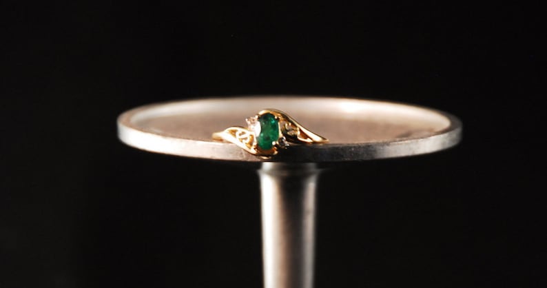 Emerald ring in 10K gold with small diamond accents