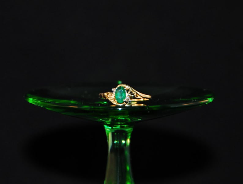 Emerald ring in 10K gold with small diamond accents