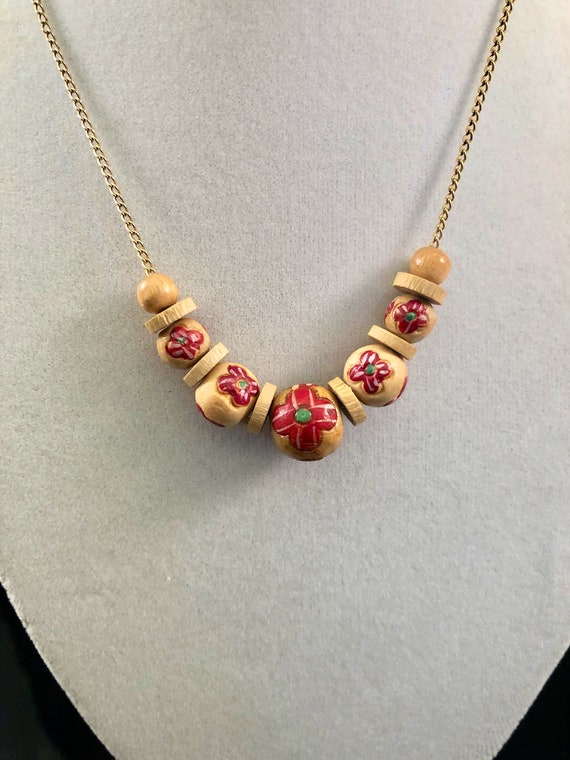 Painted wooden bead necklace on gold tone chain - image 1