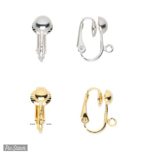May include: Two pairs of silver and gold earring clips. The clips are designed to hold earrings in place. The clips are made of metal and have a smooth finish.