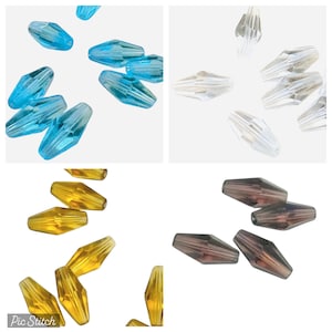 May include: A selection of faceted beads in shades of light blue, clear, gold, and brown. These beads have an elongated shape with multiple facets, creating a sparkling effect. Suitable for jewellery making and craft projects.
