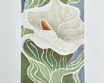 May include: A print of a white calla lily with a central orange spadix, set against a background of abstract green and blue foliage. The artwork is signed by the artist, titled Lily, and numbered 8/100 V.E. at the bottom on the white paper border.