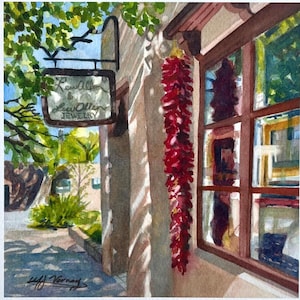 May include: Watercolor painting of a jewelry shop exterior. A sign reads "Lewallen & Lew Allen JEWELRY". A string of red chiles hangs near a window. The scene is bathed in sunlight, with shadows cast on the building's stucco wall. Green foliage frames the scene.