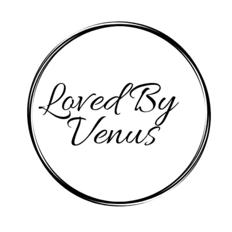 May include: Black and white logo with a circle around the text "Loved By Venus".