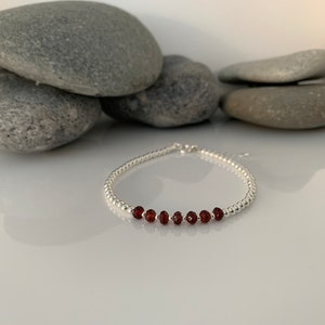 Silver 70th birthday bracelet. 70 birthday gift. 70th birthday gift for women. January Birthstone Bracelet. Garnet Bracelet