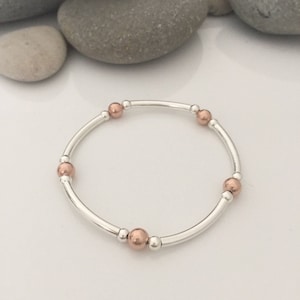 Sterling silver and rose gold stretch bracelet. Stacking bracelets. Beaded stretch bracelet. Mixed metal tube bracelet