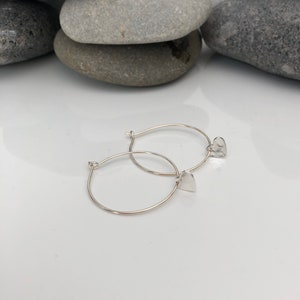 Silver heart hoop earrings. Heart hoops. Heart earrings. Sterling Silver heart earrings. Silver hoops