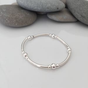 Sterling silver stretch bracelet. Stacking bracelets. Beaded stretch bracelet. Sterling silver tube bracelet. Sterling silver bangle