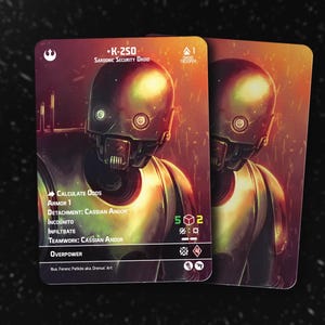 May include: Two Star Wars K-250 Sardonic Security Droid trading cards. The cards feature a detailed illustration of the droid with text including "Calculate Odds" and "Armor 1". The cards have a dark, metallic color scheme with a blurred background.