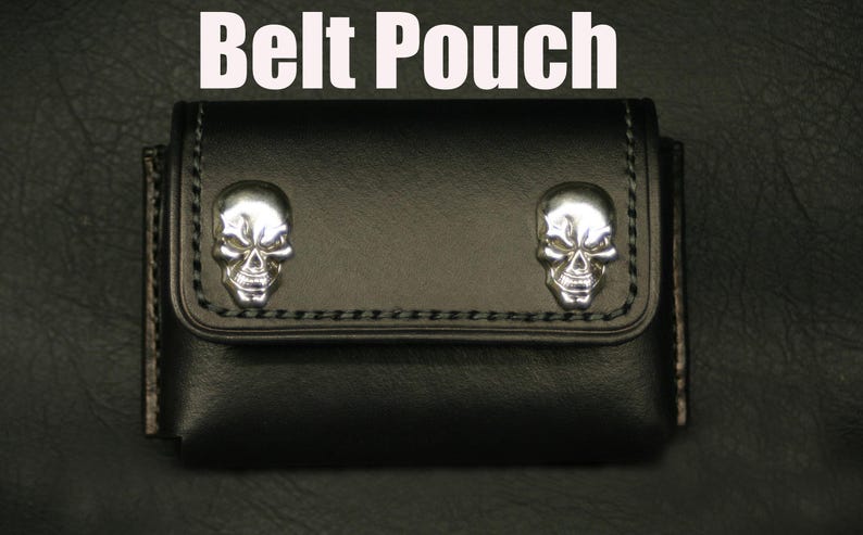 May include: Black leather belt pouch with two silver skull accents. "Belt Pouch" is written in white text above the pouch.