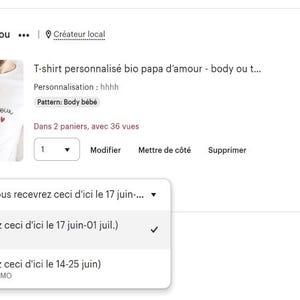 May include: A white t-shirt and a white baby bodysuit featuring the black cursive text "papa d'amour" and "d'augustin" with a small red heart on the t-shirt, and the text "papa d'amour" with three red hearts on the baby bodysuit.
