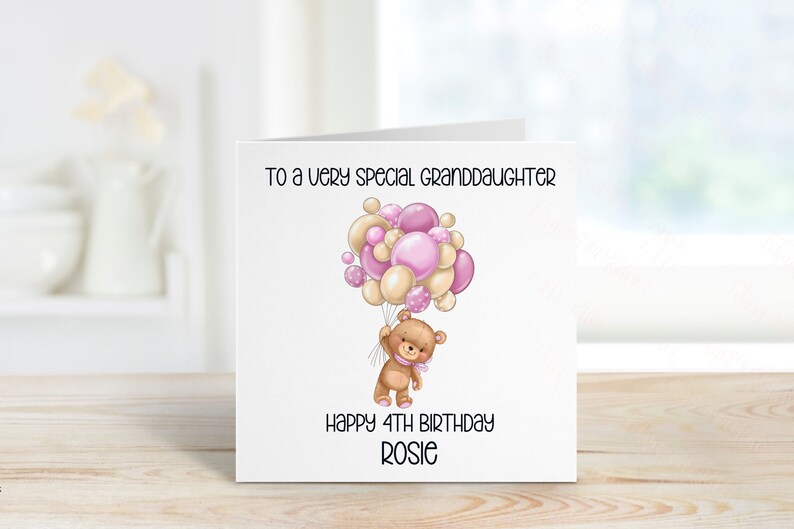 May include: A white card with a pink and beige teddy bear holding balloons that says "To a very special granddaughter Happy 4th Birthday Rosie"