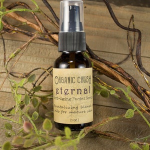 May include: A brown glass bottle with a black pump top and a label that reads "ORGANIC CRUSH eternal Anti-Aging Facial Serum Revitalizing blend of oils for mature skin (1 oz.)"
