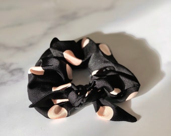 Dottie soft pink polka dot black scrunchie