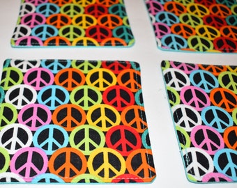 Peace cotton square fabric coasters handmade multi colored set of 4 with solid turquoise color on rear they are reversible