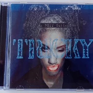 May include: A CD case with a blue and white design. The front cover features a woman with dark hair and a blue and white graphic that says "IT'S BIG SKY" and "A RUFF Guide".