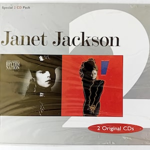 May include: A two-CD pack of Janet Jackson's Rhythm Nation 1814 album. The front cover features a black and white photo of Janet Jackson with a red background. The back cover features a photo of Janet Jackson with a blue background. The text "2 Original CDs" is printed on the bottom of the back cover.