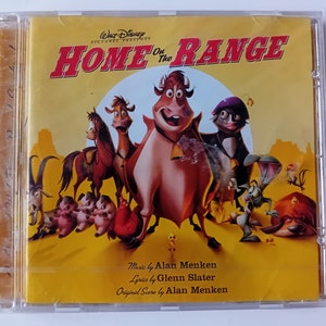 May include: A CD case for the Disney animated film "Home on the Range." The cover features cartoon characters, including cows, horses, and other animals, set against a yellow background. The title is in red, with the Disney logo at the top.