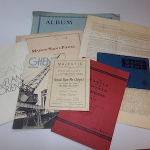 May include: A collection of vintage paper ephemera, including a program for the play "Good Bye Mr Chips!" starring Robert Donat and Green Garson, a guide to the Castle of the Counts of Flanders, and a pamphlet titled "GAND - General Information".
