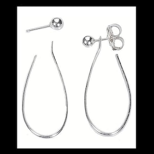 May include: A pair of silver teardrop shaped hoop earrings. The earrings are made of a thin wire and have a smooth finish.
