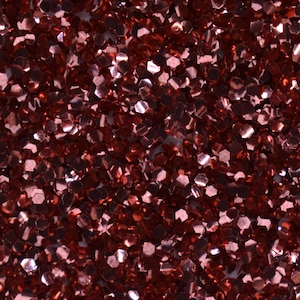 May include: A close-up of a red glitter texture. The glitter is made up of small, hexagonal-shaped pieces.
