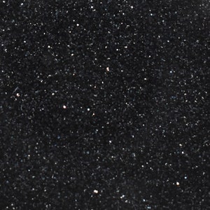 May include: A black background with a fine, sparkly texture. The texture is made up of tiny, iridescent particles that create a shimmering effect.