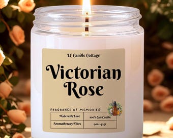 May include: A clear glass jar candle with a lit wick and white wax. The label reads LC Candle Cottage, Victorian Rose, Fragrance of Memories, Made with Love, 100% Soy Candle, Aromatherapy Vibes, and 9oz/252gr, featuring a small floral graphic.