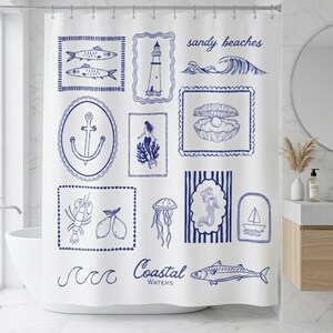 May include: White shower curtain with blue nautical illustrations, including fish, a lighthouse, waves, an anchor, a mermaid, a clam with a pearl, a lobster, lemons, a jellyfish, and a sailboat. The text "sandy beaches" and "Coastal Waters" are also included.