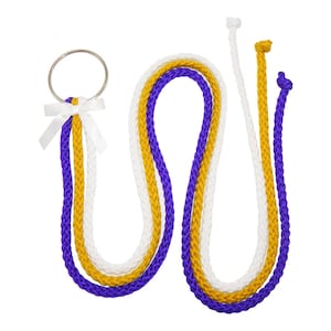 May include: Three strands of braided rope, one purple, one gold, and one white, tied together with a small white bow and a silver ring.