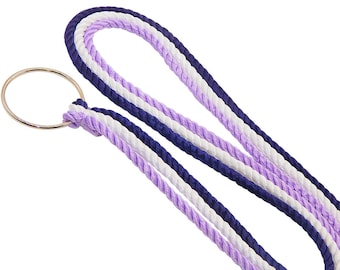 May include: A lanyard crafted from three twisted ropes in dark blue, white, and light purple, looped through a circular gold-toned metal ring. The ropes are arranged in parallel strands, creating a continuous, braided-style loop design.