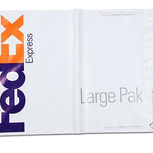 May include: White FedEx Express shipping envelope with a purple and orange FedEx logo on the left side and the text "Large Pak" on the right side.