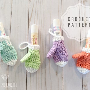 May include: Four crocheted mitten-shaped holders for lip balm tubes. The mittens are in green, light green, purple, and orange. The text "CROCHET PATTERN" is visible in the top right corner of the image.